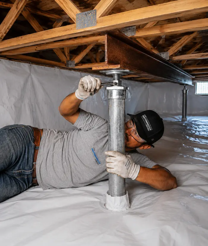 What causes sagging floors in crawl space homes? We install steel beams with steel support posts in crawl space to support sagging floor joists, Marietta, Georgia